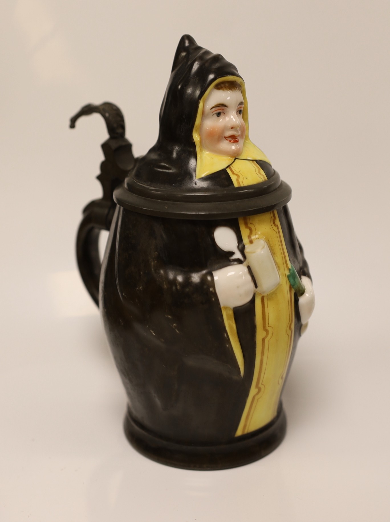 A continental figural lidded jug a carved treen comport and two Mauchline boxes, jug 21cms high